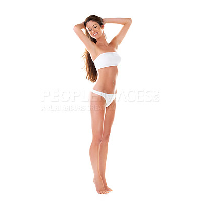 Buy stock photo Studio shot of a beautiful young brunette woman in a white bikini with her hands in her hair isolated on white