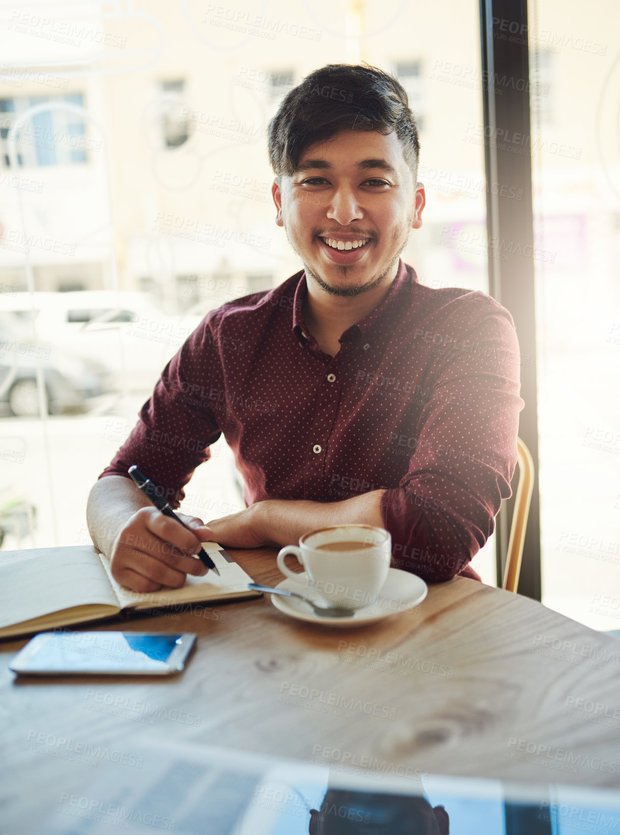 Buy stock photo Portrait of a young student studying in a cafe