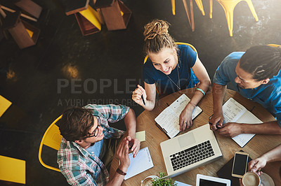 Buy stock photo High angle shot of a group of students studying in a coffee shop
