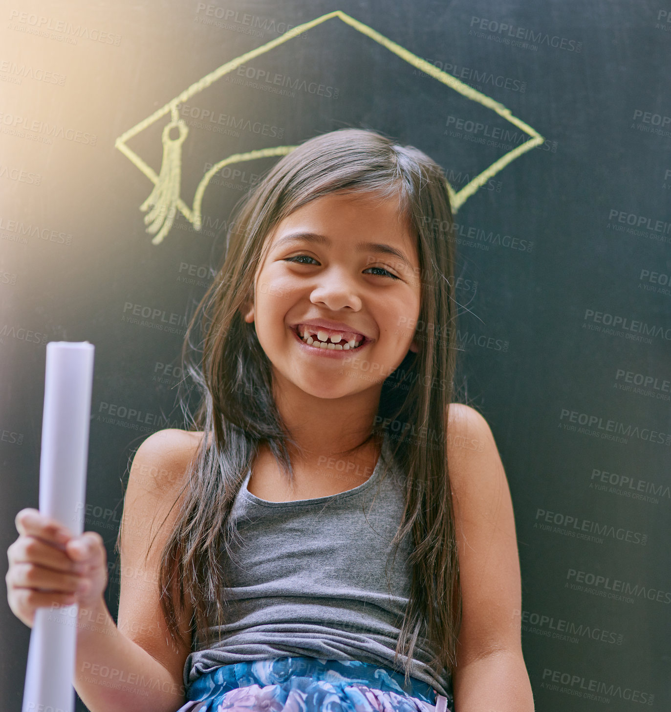 Buy stock photo Portrait of a little girl posing against a blackboard with a drawing of a graduation cap