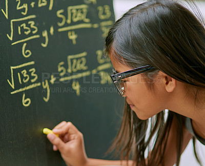 Buy stock photo Girl, writing solution and blackboard with chalk as genius for learning, education and childhood development. Student, child and classroom for tuition, growth and knowledge in assessment for math