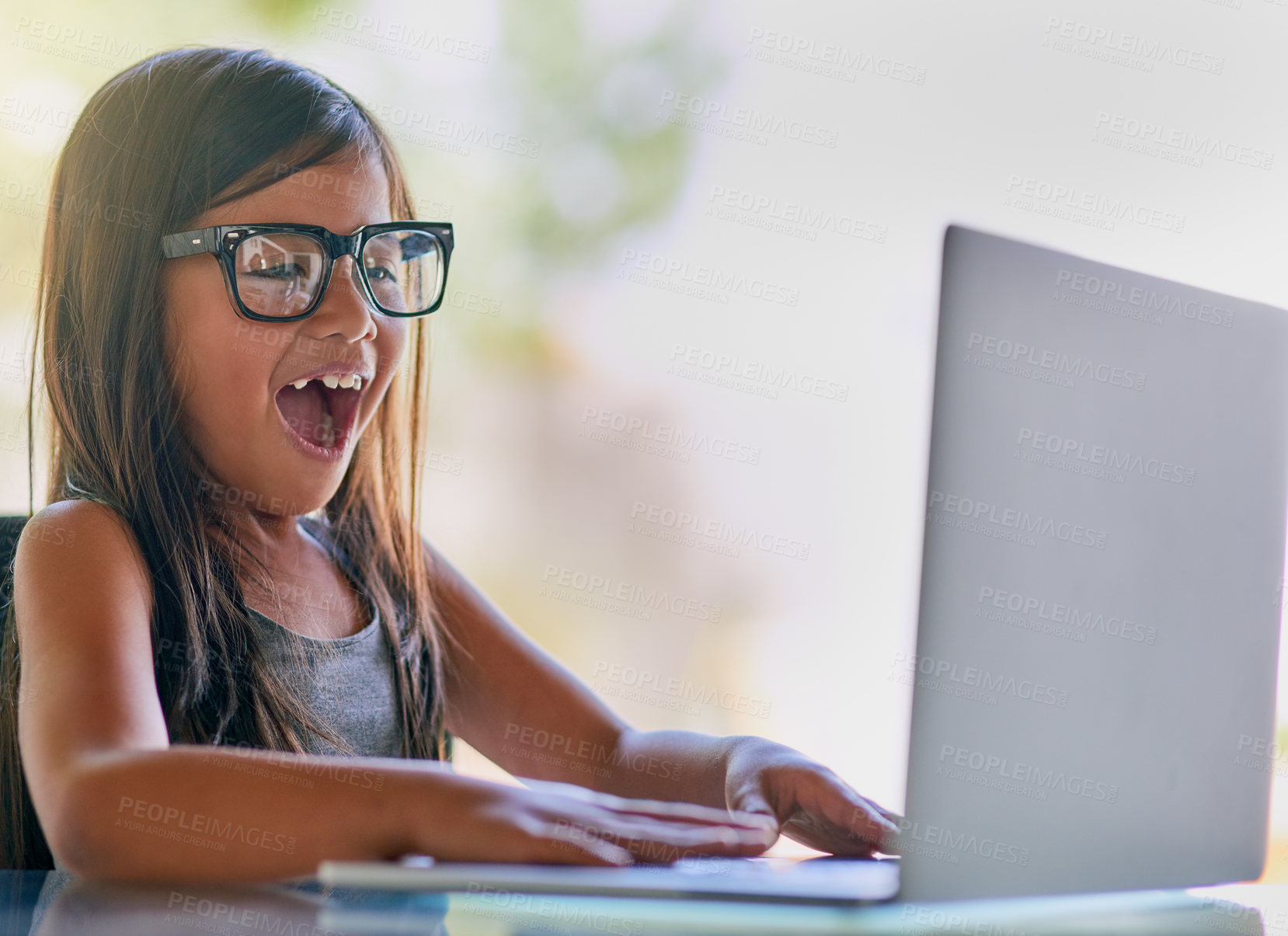 Buy stock photo Child, laptop and wow or surprise in living room for development, education and knowledge in home. Glasses, student and technology for elearning, confidence and kindergarten with pride for assessment