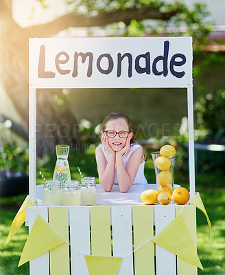 Buy stock photo Portrait of a little girl selling lemonade from her stand outside