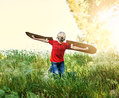 Buy stock photo Shot of a little boy pretending to fly outside
