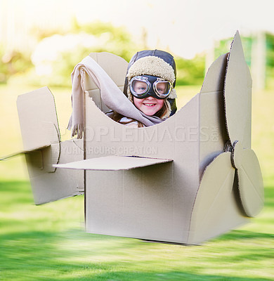 Buy stock photo Portrait of a little boy pretending to fly in a cardboard jet