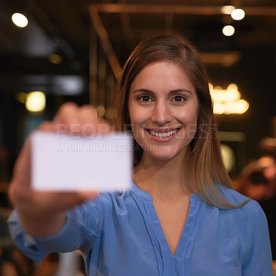 Buy stock photo Cropped portrait of an attractive young woman holding up a blank business card