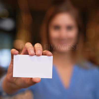Buy stock photo Cropped portrait of an unrecognizable young woman holding up a blank business card