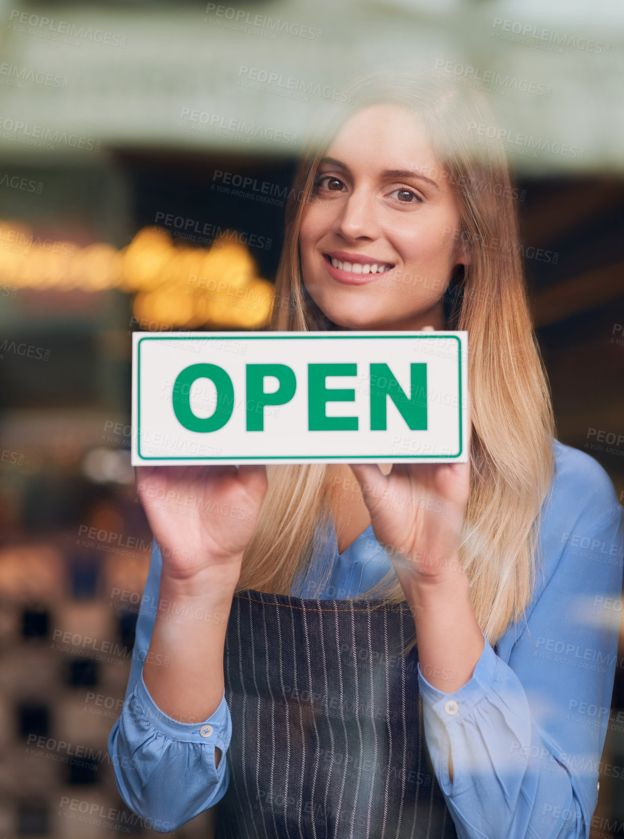 Buy stock photo Cropped portrait of an attractive young woman opening up her coffee shop