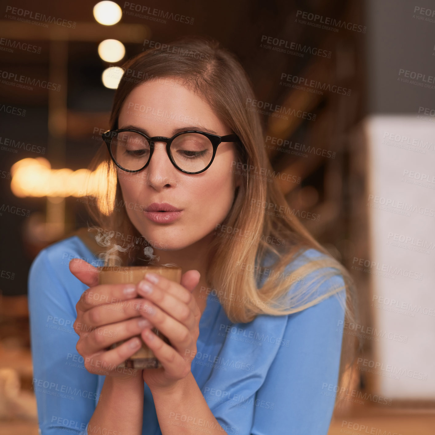 Buy stock photo Woman, cafe and blowing on coffee, cappuccino and relax on break with warm caffeine drink or beverage. Calm, weekend and German female person, hospitality shop and chilling in restaurant for latte