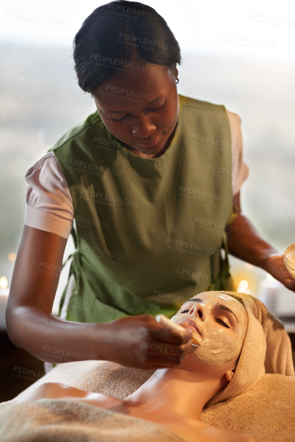 Buy stock photo Shot of a young woman receiving a beauty treatment in a spa