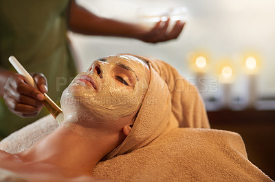 Buy stock photo Shot of a young woman receiving a beauty treatment in a spa