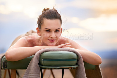 Buy stock photo Relax, portrait and woman outdoor by spa for wellness treatment with luxury resort on summer vacation. Bed, zen or beauty salon and female customer happy for stress relief, body care and calm.