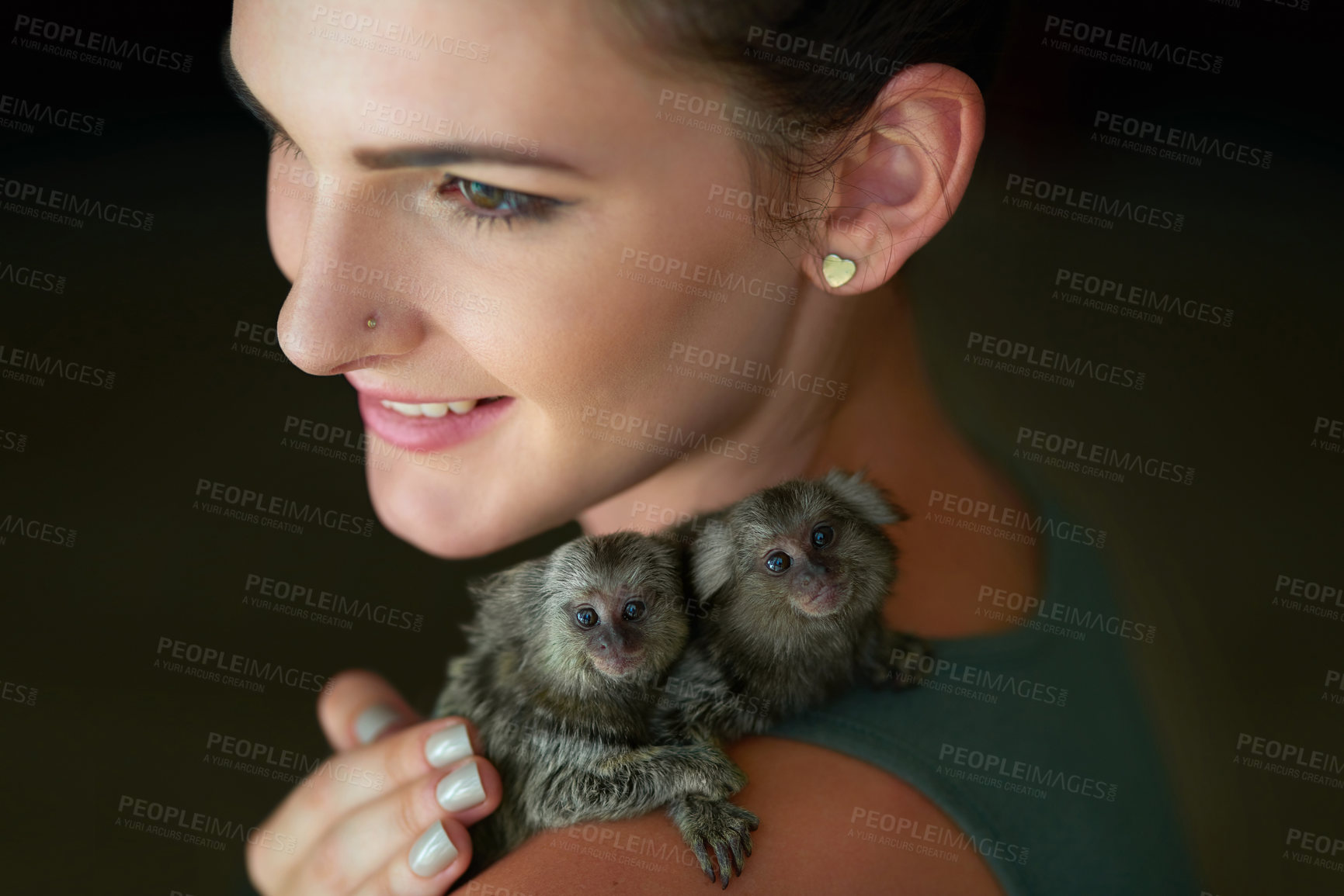 Buy stock photo Woman, smile and monkey with pet, animal and primate in a studio with small, cute and Amazon creature. Happy, thinking and young pigmy marmoset with idea and black background with love and affection