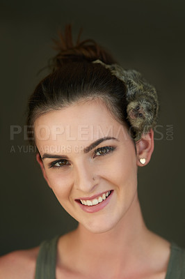 Buy stock photo Cropped portrait of an attractive young woman posing with a pigmy marmoset