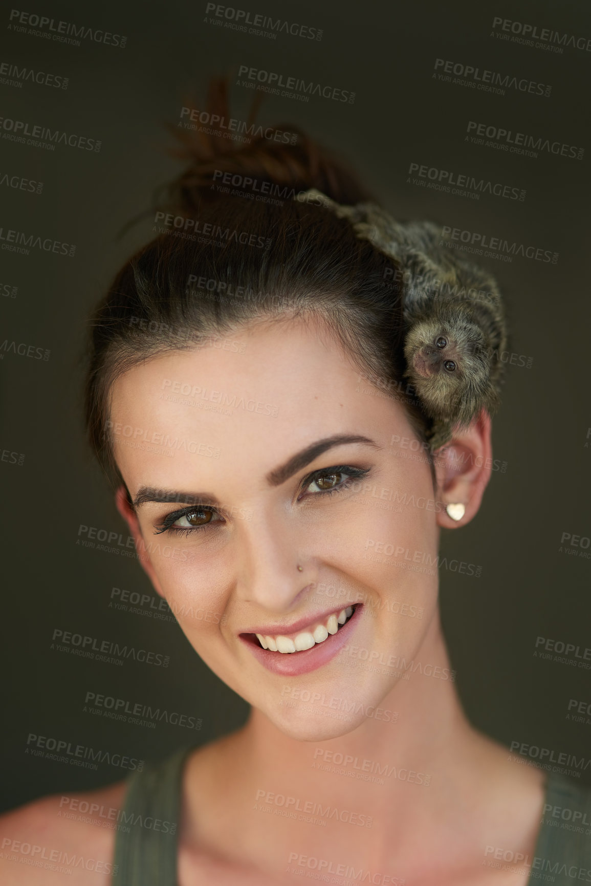 Buy stock photo Cropped portrait of an attractive young woman posing with a pigmy marmoset