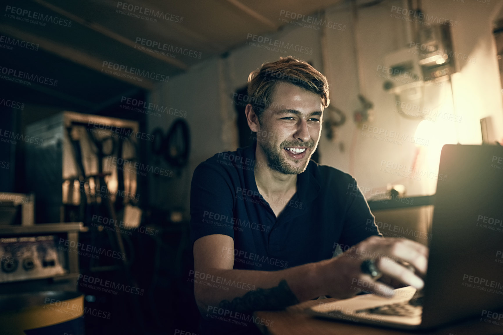 Buy stock photo Night, home and man with typing on laptop for freelance job, trading and online communication. Remote work, overtime and smile with technology at table for cryptocurrency, investment and planning