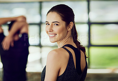 Buy stock photo Rearview portrait of an attractive young woman warming up at the gym before a workout