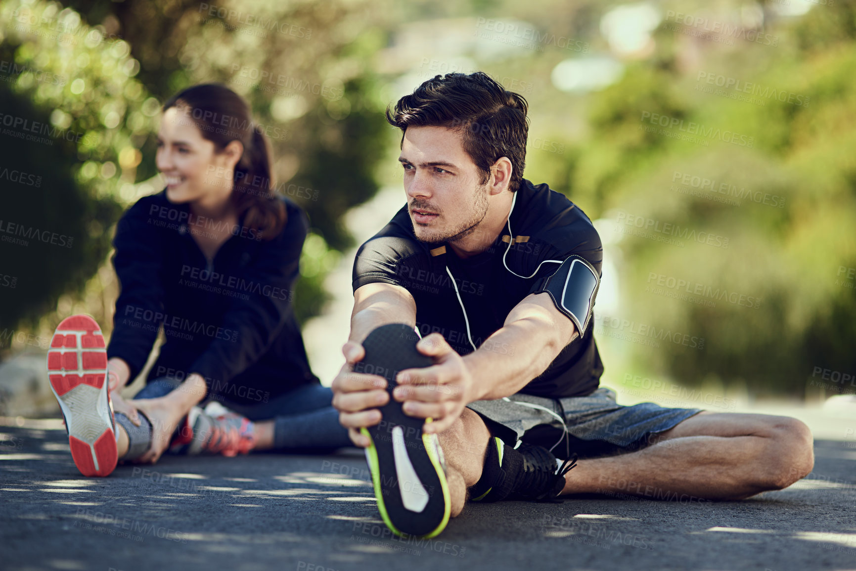 Buy stock photo Man, stretching legs and thinking before fitness, exercise and workout on road outdoor. Male athlete, woman and warm up for health, wellness and flexibility with endurance or couple for motivation