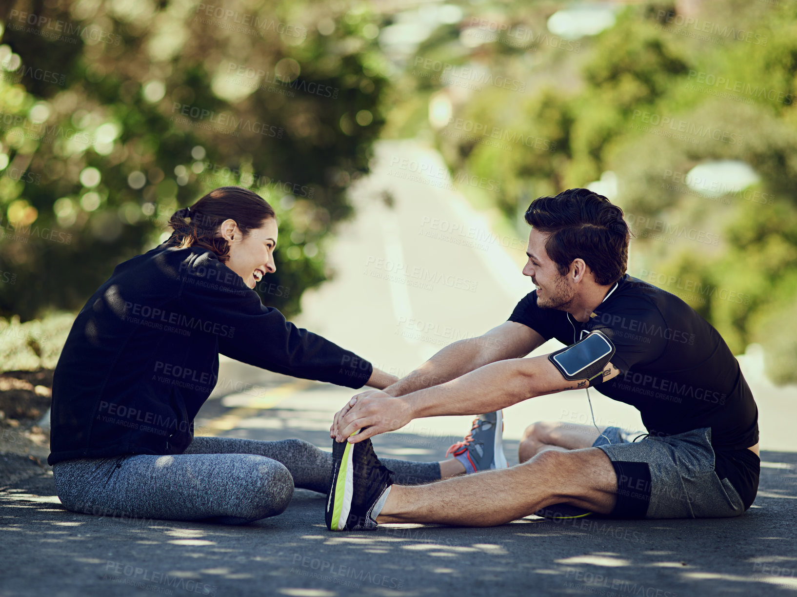 Buy stock photo Couple, stretching legs and happy before fitness, exercise and workout on road outdoor. People, man and woman training with warm up for health, wellness and flexibility with endurance for running