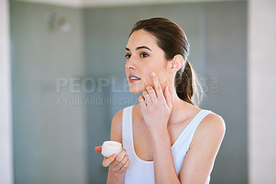 Buy stock photo Woman, face and beauty cream for skin care in home bathroom for health, glow and wellness. Female model person with a product container for dermatology, cosmetics and healthy facial or sunscreen