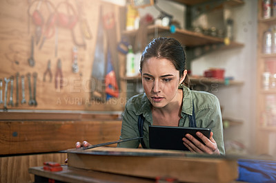 Buy stock photo Shot of a young female designer in her workshop