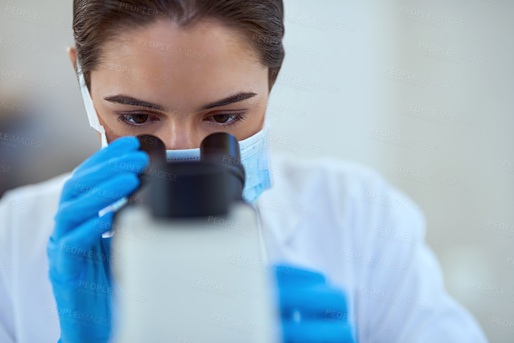 Buy stock photo Shot of a female scientist working alone in the lab