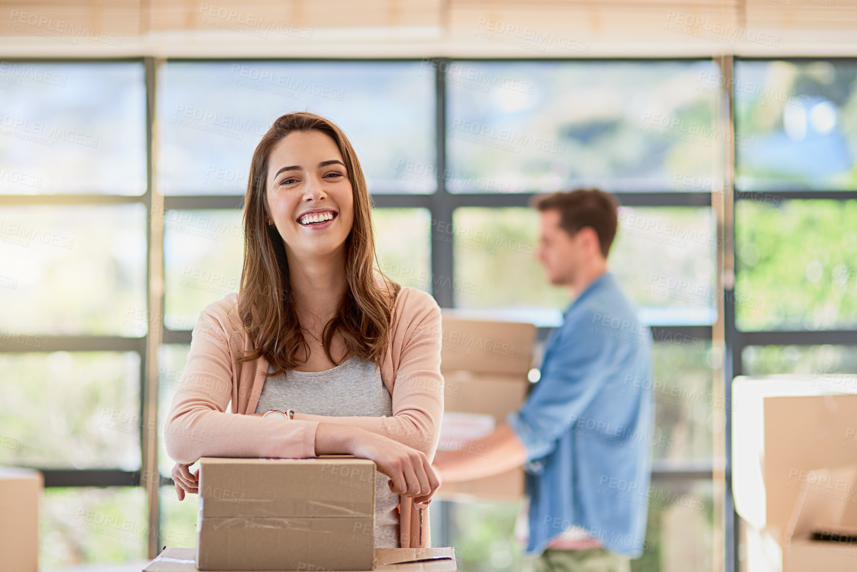 Buy stock photo Woman, portrait and moving house with boxes, happy couple and real estate for new home or opportunity. Cardboard, rental apartment and property investment together, proud and man carrying parcel