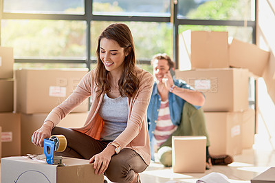 Buy stock photo Cropped shot of a young couple moving house