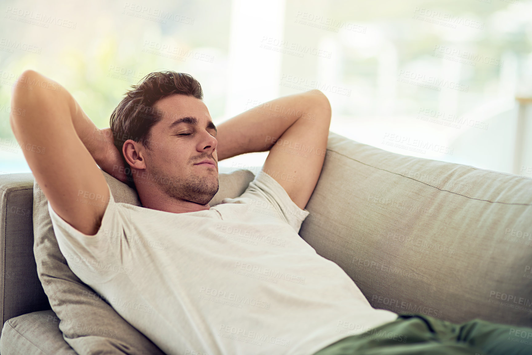 Buy stock photo Man, sleeping and sofa in rest for wellness, health and comfort in home with tired or fatigue. Male person, nap and couch for relax, burnout and calm in peaceful, break and eyes closed in living room