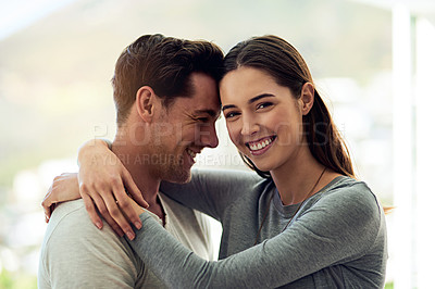 Buy stock photo Portrait of a happy young couple in a loving embrace