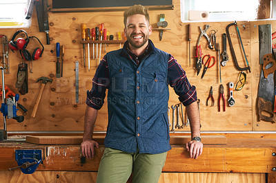 Buy stock photo Portrait of a handsome young handyman standing in his workshop
