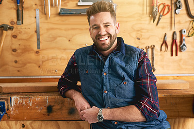 Buy stock photo Portrait of a handsome young handyman standing in his workshop