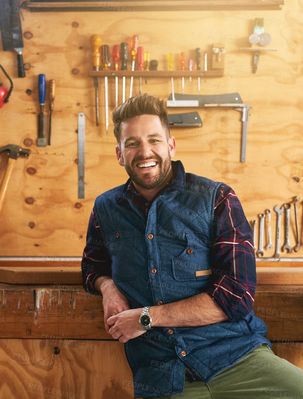 Buy stock photo Man, contractor and portrait with smile in workshop for career, renovation or maintenance services. Male carpenter, wood workbench and happiness for job in construction, home project or repair work