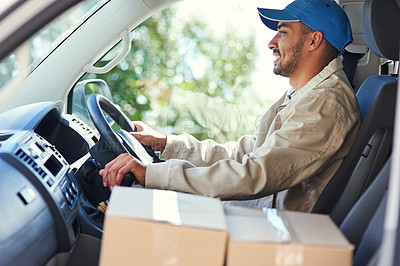 Buy stock photo Cropped shot of a handsome young man making deliveries in his van