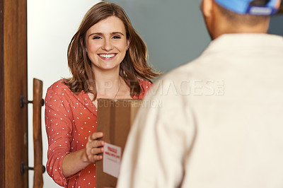 Buy stock photo Cropped portrait of a young woman receiving her package from postal worker