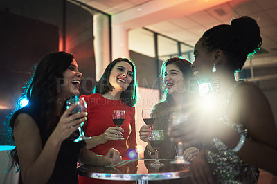 Buy stock photo Cropped shot of a group of friends having drinks at a social event