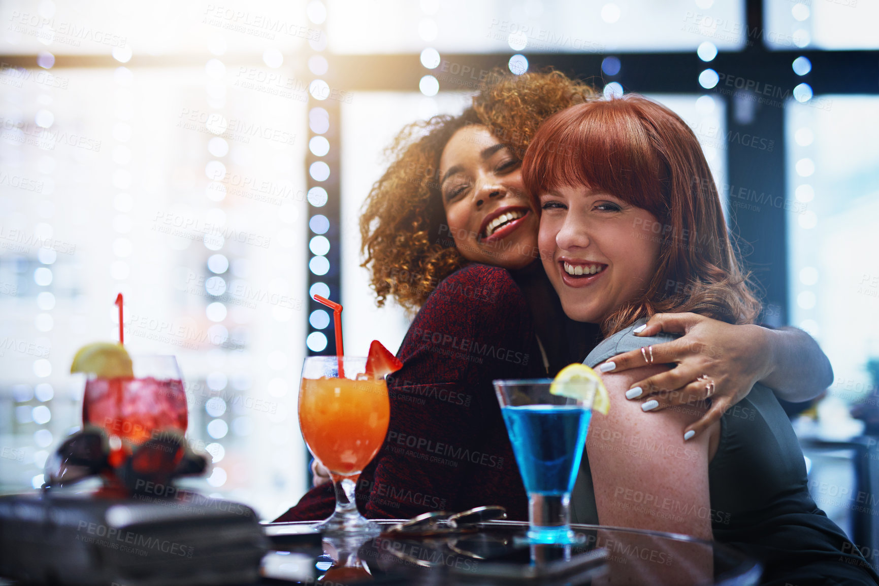 Buy stock photo Portrait of two young friends having drinks at a party