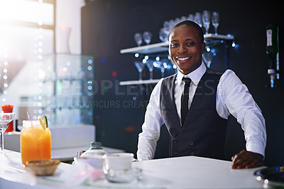 Buy stock photo Cropped shot of a well-dressed bartender standing behind the counter