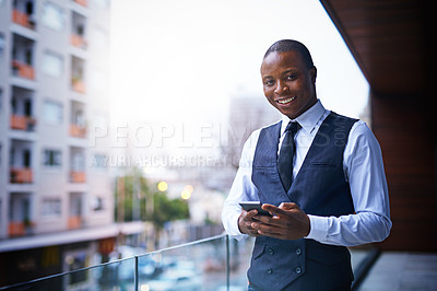 Buy stock photo Cropped shot of a well-dressed businessman standing on a balcony