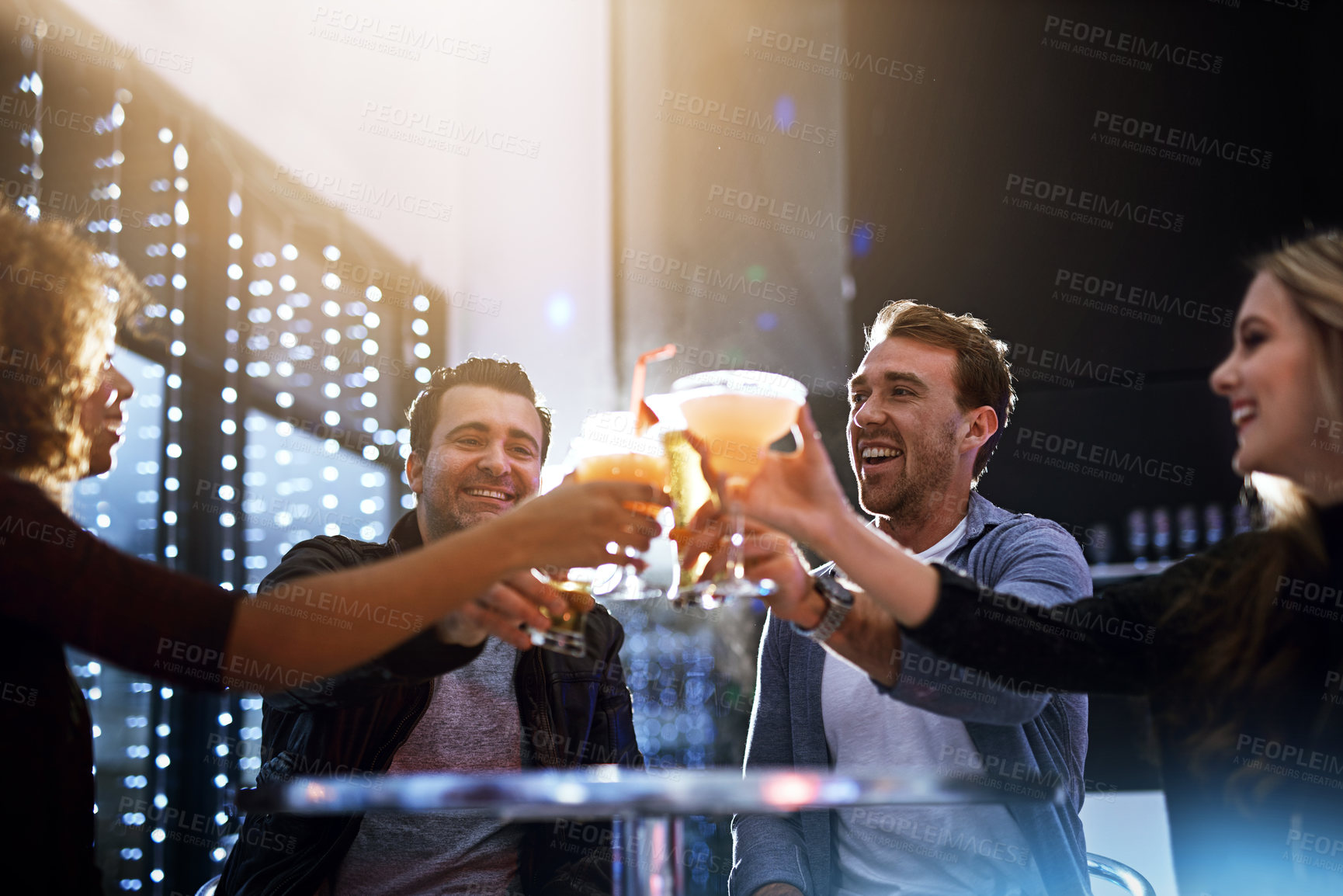 Buy stock photo Cropped shot of a group of friends having drinks together at a party