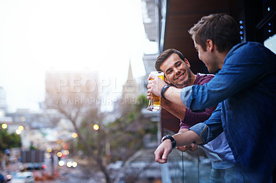 Buy stock photo Men, beer and balcony toast in city of New York, USA for happy gathering of friends on weekend. Cityscape, cheers and casual hangout celebration of people bonding with afternoon alcohol drinks.

