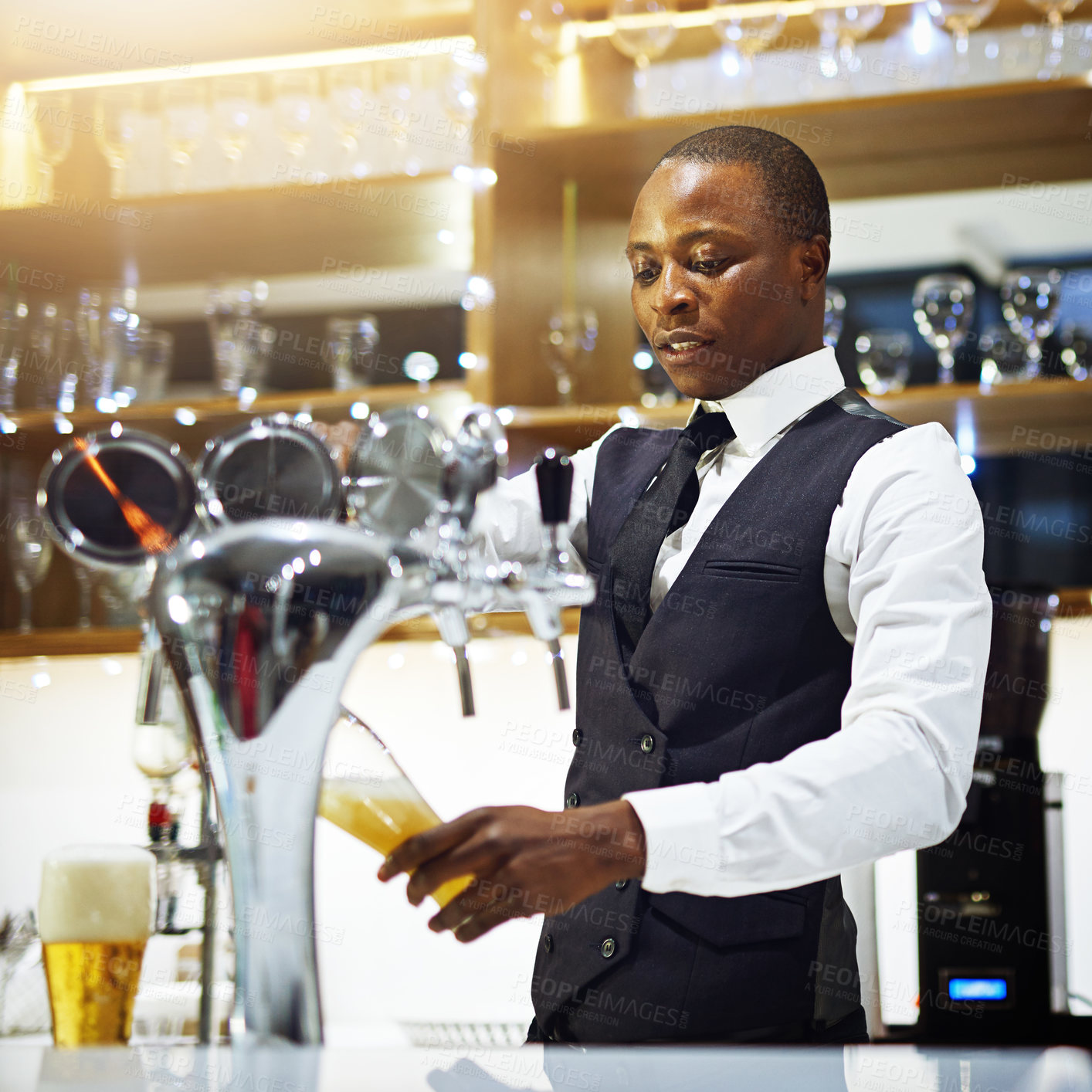 Buy stock photo Black man, bartender and tap for drink in restaurant, hospitality and counter server for alcohol. Male person, cocktail and beer glass at winery or hotel bar, waiter confidence and barman selection