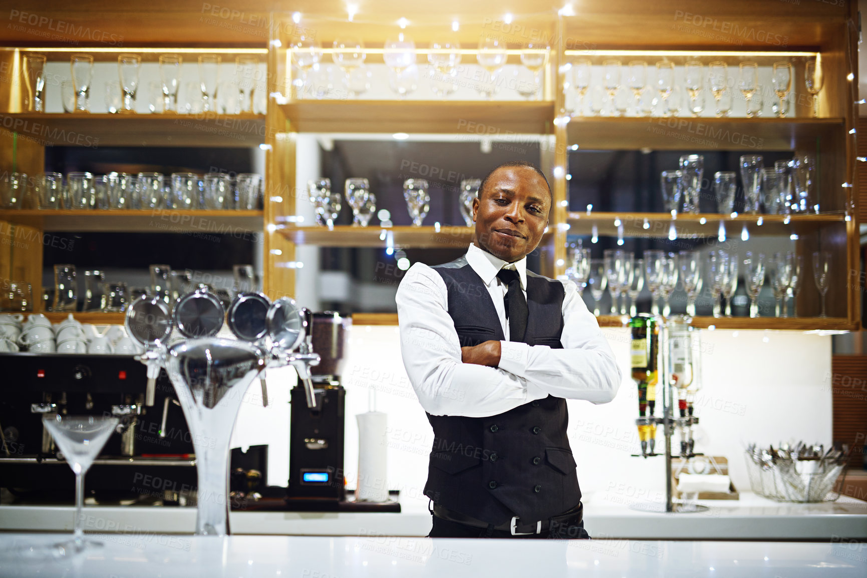 Buy stock photo Black man, bartender and confident portrait in hotel, hospitality and counter server for alcohol. Male person, cocktail and martini at winery or restaurant, waiter pride and barman arms crossed