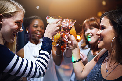 Buy stock photo Cropped shot of a group of friends having drinks together at a party