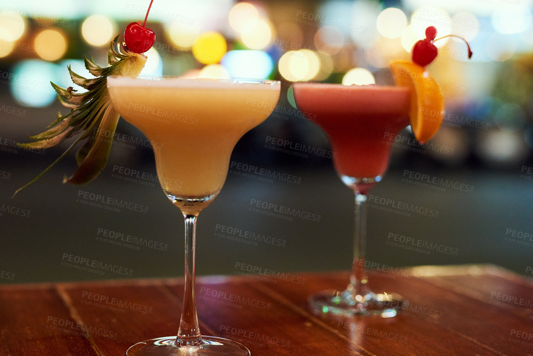 Buy stock photo Shot of two cocktails on a table in a bar