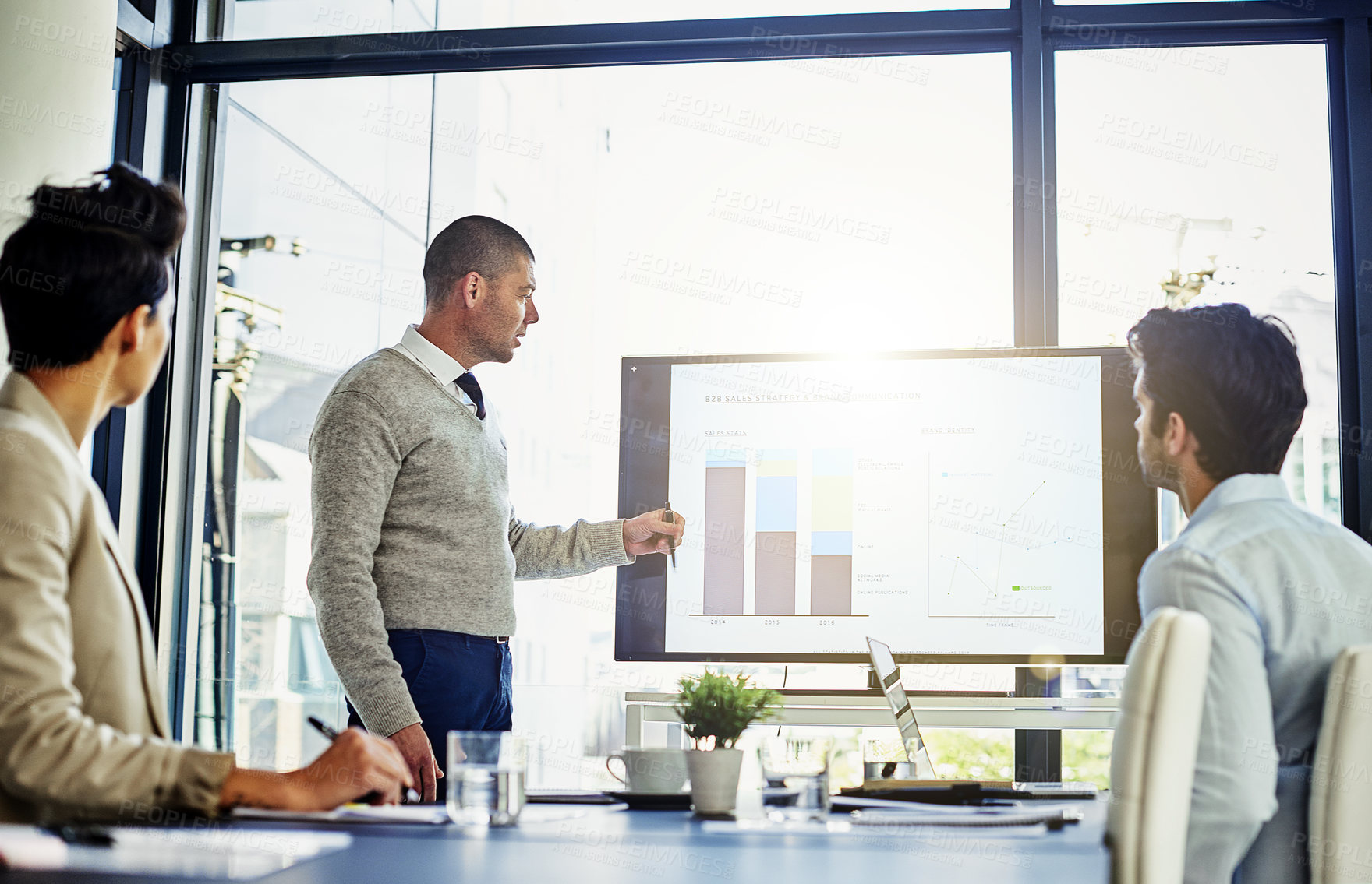 Buy stock photo Shot of a businessman giving a presentation in the boardroom