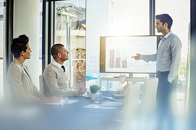 Buy stock photo Shot of a businessman giving a presentation in the boardroom