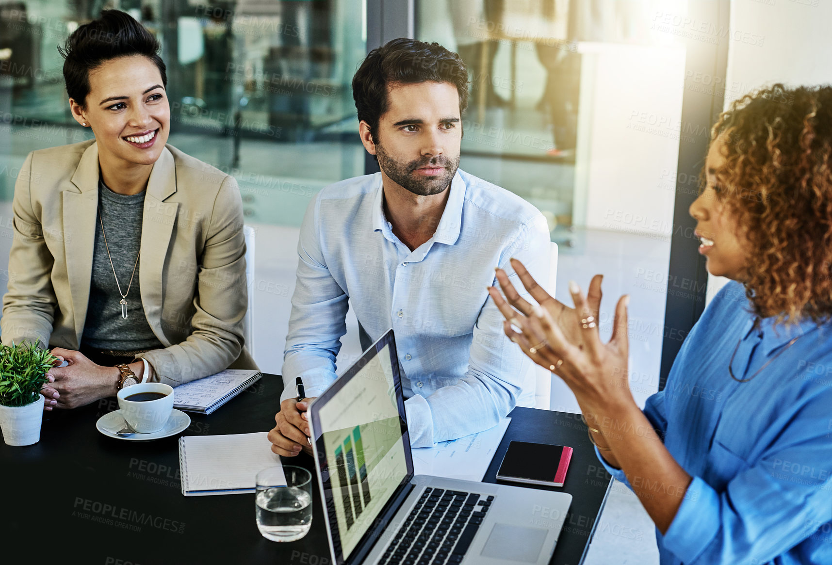 Buy stock photo Shot of a group of colleagues meeting in the boardroom