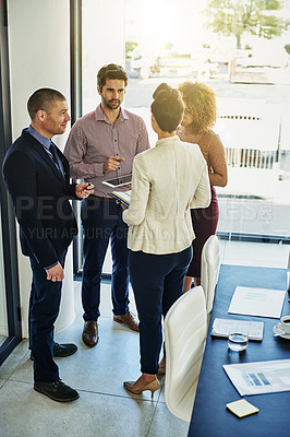 Buy stock photo Shot of a group of colleagues meeting in the boardroom