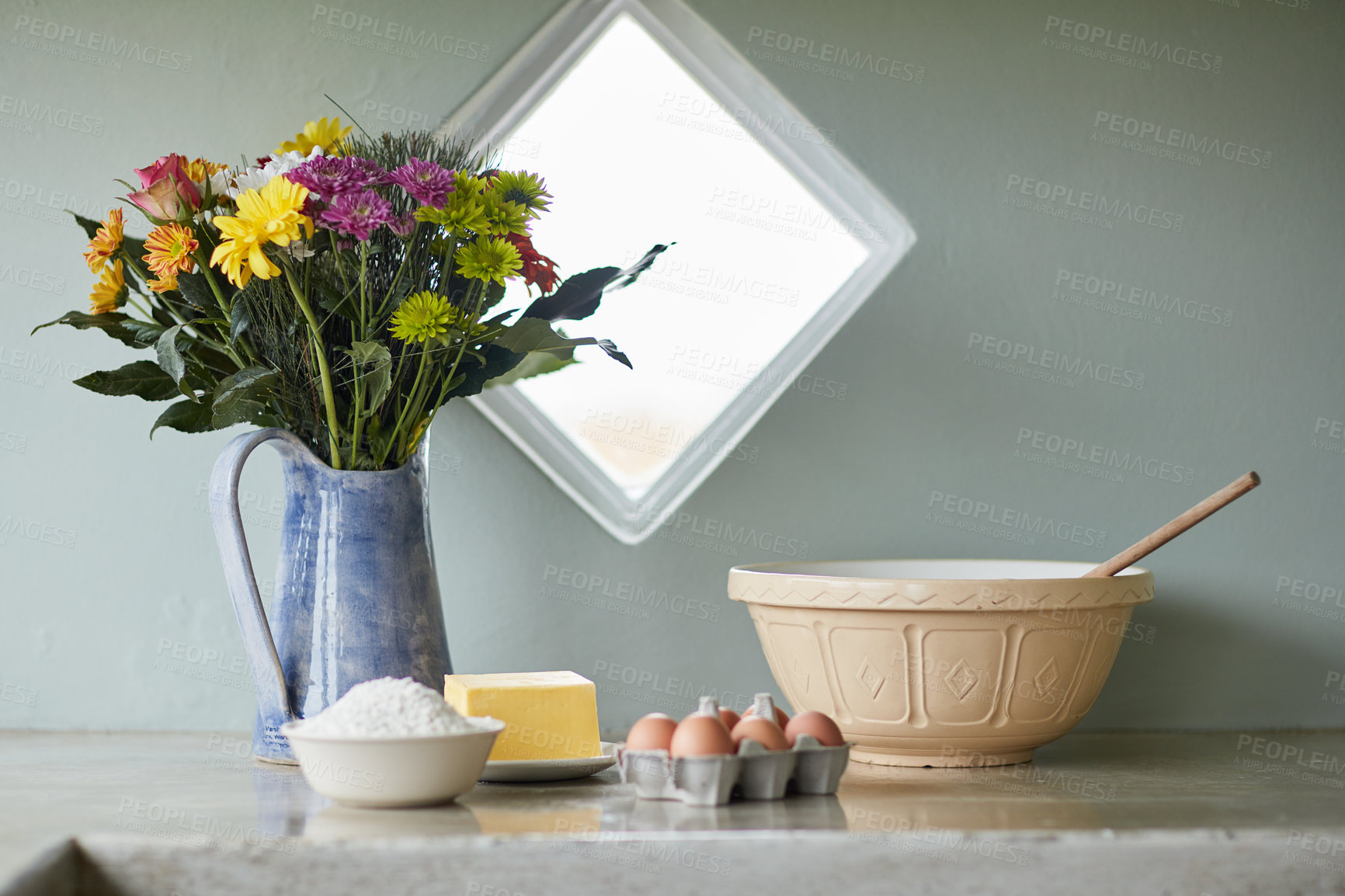 Buy stock photo Shot of a counter with baking ingredients arranged on it in a country kitchen